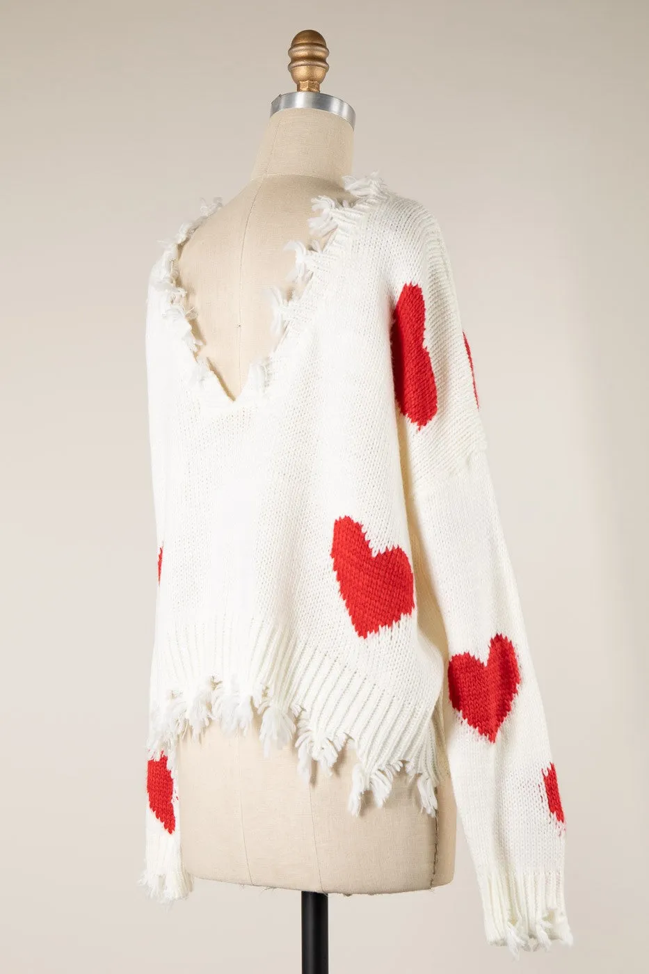 HEART PATTERN DISTRESSED HEM CABLE KNIT SWEATER