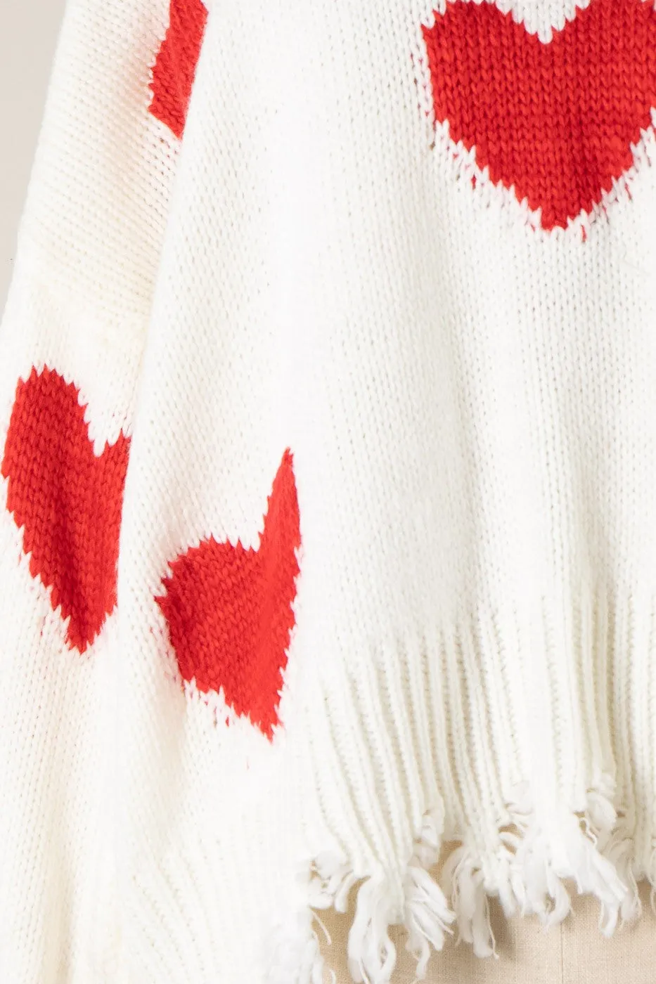 HEART PATTERN DISTRESSED HEM CABLE KNIT SWEATER