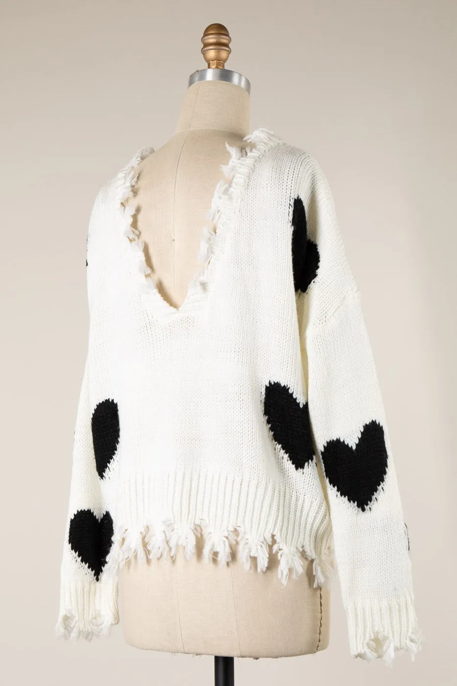 HEART PATTERN DISTRESSED HEM CABLE KNIT SWEATER